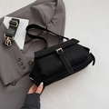 Elegant black faux suede crossbody bag with gold buckle and wide nylon strap - Black