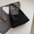 Minimalist black suede tote bag with adjustable shoulder strap for commuter style - Black