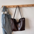 Minimalist large tote bag in dark brown faux leather with long handles and sleek texture - Brown