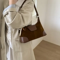 Detail view of brown suede and leather crossbody bag with colorful beaded tassel detail - With Pendant / Brown