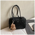 Detail of black quilted shoulder bag with plush bear charm and metallic brand logo - Black Small With Pendant