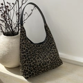 Detail of leopard print hobo bag showing the wide black leather strap and textured fabric - Leopard Khaki