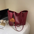Minimalist large tote bag in burgundy matte leather with a brown plush bear charm - Wine Red With Pendant