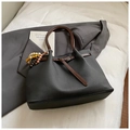 Dark grey minimalist tote bag with brown handles and a stylish beaded tassel accessory - Black with Pendant
