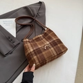 Brown plaid faux fur bucket bag featuring a gold bow detail and double leather straps - Brown