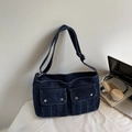 Deep blue denim tote bag with dual front cargo pockets and adjustable shoulder strap - Dark Blue