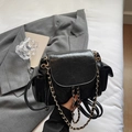 Chic black quilted backpack with gold chain straps and convenient side pockets for women - Black