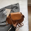 Brown quilted crossbody bag with gold chain strap and side flap pockets in chic style - Brown
