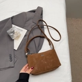 Minimalist brown suede bucket bag with silver logo detail and slim shoulder strap - Coffee No Charm