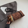 Detail of leopard print cylindrical shoulder bag with ethnic wooden bead tassel - Brown (With Charm)