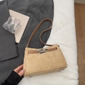 Khaki suede handbag with silver twist lock and dark brown leather strap in still life - Khaki No Pendant