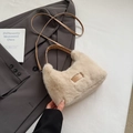 Chic beige faux fur shoulder bag with leather patch on a gray blazer backdrop - Beige No Pendant