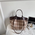 Detailed view of brown checkered tote bag with leather trim and matching shoulder strap - Khaki Plaid