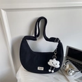 Detailed view of black corduroy crescent bag with adjustable strap and cloud charm decoration - With Pendant / Black