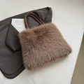 Plush brown faux fur tote bag with woven handles on a blazer background for autumn fashion - Coffee without Pendant