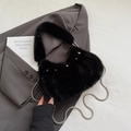 Black plush faux fur handbag featuring silver star studs and a metal chain strap - Black