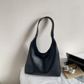 Close-up of black woven hobo bag showing intricate Intrecciato texture for work - Black