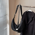 Minimalist black crescent crossbody bag with vintage matte texture and brand label detail - Black (Without Charm)