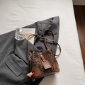Fashionable leopard print bucket bag with brown leather trim and adjustable shoulder strap - Coffee No Charm