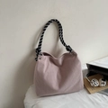 Detail of pink corduroy tote bag with black and white woven rope handle and metal ring - Pink