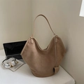 Detail of camel suede tote bag with heart charm next to a laptop and headphones - Khaki