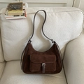 Detail of vintage brown suede shoulder bag featuring a metal buckle and soft fabric texture - Brown