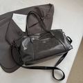 Detail of vintage grey tote bag showing matte texture and metal snap button pocket - Dark Brown
