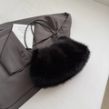 Furry black faux fur tote bag with slim leather handles and plush winter texture - Black