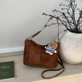 Detail of suede tote bag featuring brown finish and a cute teddy bear charm accessory - Brown with Pendant