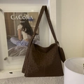 Detail of a dark brown leopard print bucket bag with matte suede texture and shoulder strap - Leopard Print (Coffee) / Brown