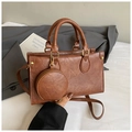 Detail of vintage brown textured handbag with gold zipper and mini round coin purse - Brown