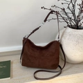 Dark brown suede hobo bag with braided strap and crossbody strap shown in a home setting - Coffee without Pendant