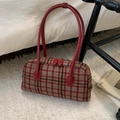 Detail of vintage plaid bag showing thick tweed fabric and red leather handles - Red