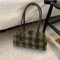 Close-up of green and brown checkered wool shoulder bag with long leather handles - Green