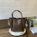 Minimalist dark brown litchi pattern bucket bag with adjustable shoulder strap and handles - Cocoa Without Charm