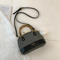 Detail of shell bag with bamboo handle, matte gray finish, and plush bird charm accessory - Grey Without Pendant