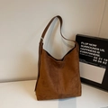 Detail view of brown suede Hobo shoulder bag with metallic buckle and vertical stitching - Brown
