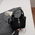 Minimalist black bucket bag with matte-shiny splicing and silver metal lock on a suit - Black without Pendant