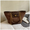 Detail of a brown suede tote bag featuring a diamond-quilted flap and gold turn-lock closure - Coffee (No Pendant)