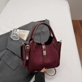 Elegant burgundy bucket bag with glossy patent leather and suede textures with a silver clasp - Wine Red Without Pendant