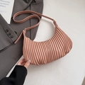 Detailed view of the pink pleated texture and craftsmanship on this trendy hobo bag - Pink