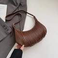 Detailed close-up of brown pleated crescent shoulder bag with high-quality PU leather texture - Brown