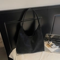 Minimalist black matte faux leather Hobo shoulder bag with a sleek single strap design - Black