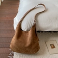 Minimalist brown suede hobo bag with adjustable leather strap in a cozy home setting - Brown (Without Pendant)