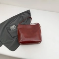 Minimalist large capacity tote bag in deep burgundy leather with matching shoulder strap - Red