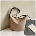 Minimalist beige suede bucket bag with black leather strap and gold hardware accents - Grey Without Pendant