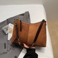 Detail of vintage brown suede tote bag with shiny leather trim and gold chain strap - Brown