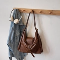Vintage caramel brown leather crossbody bag with adjustable strap on wooden hook - Brown No Pendant