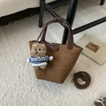 Detail of brown suede bucket bag with leather handles and cute bear plush charm - Brown with Pendant