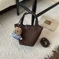Detail view of dark coffee suede bucket bag with leather handle and cute bear charm - Coffee with Pendant